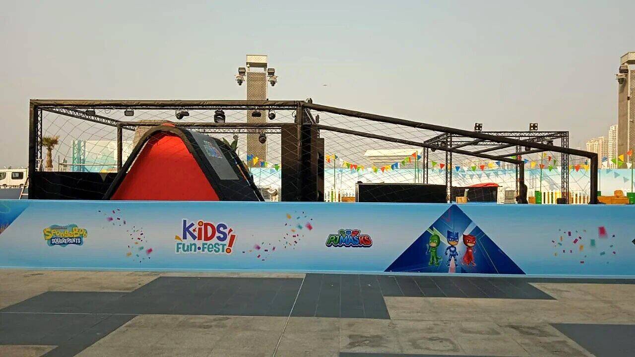 Kids Fun Fest outdoor event, perimeter hoarding branding and themed truss stages