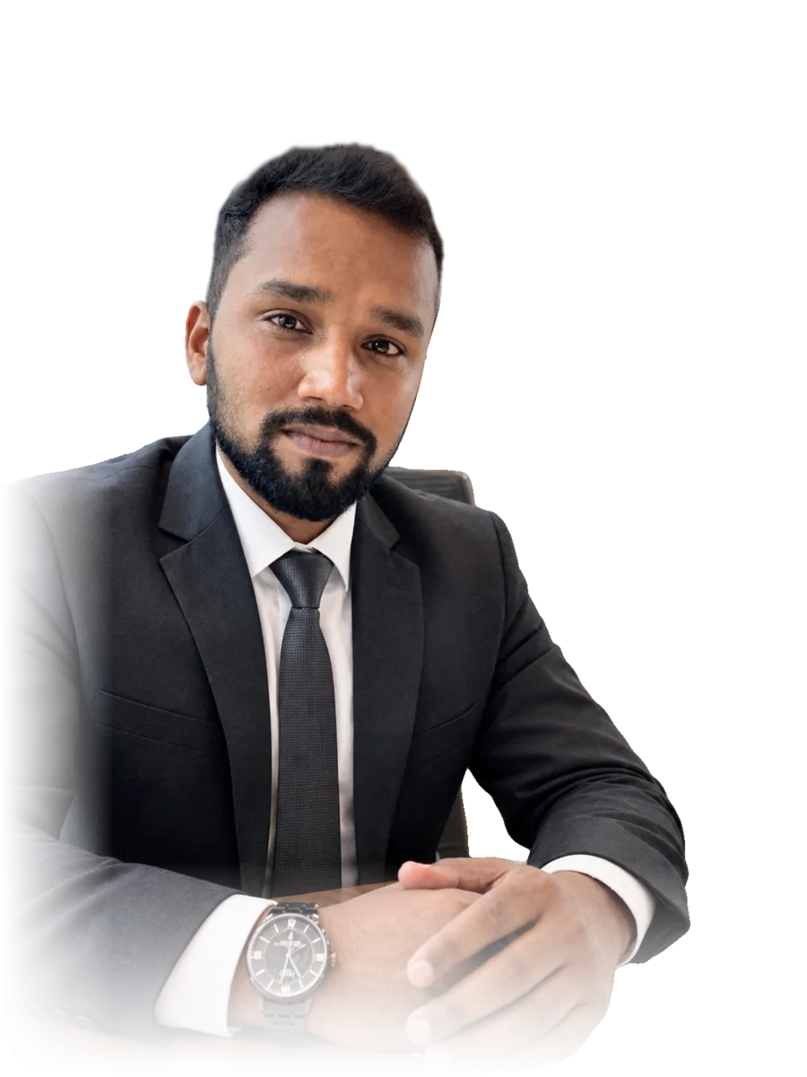 Jithin Prasannan in a charcoal suit and tie